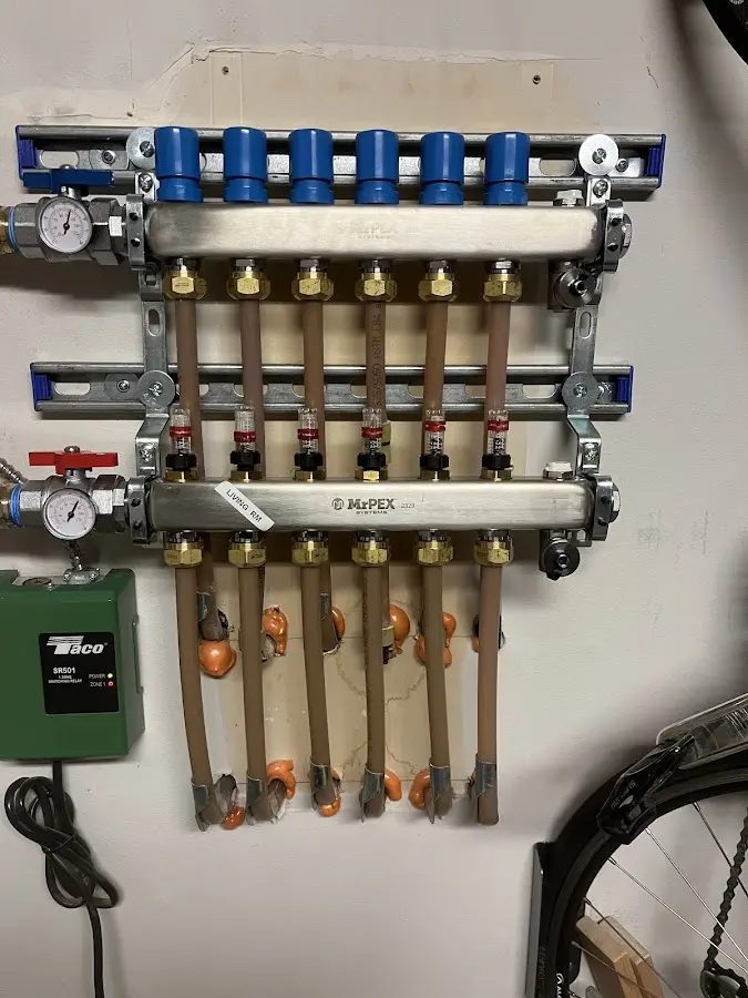 Plumber performing Water Heater Repair at a residential property in Sanger